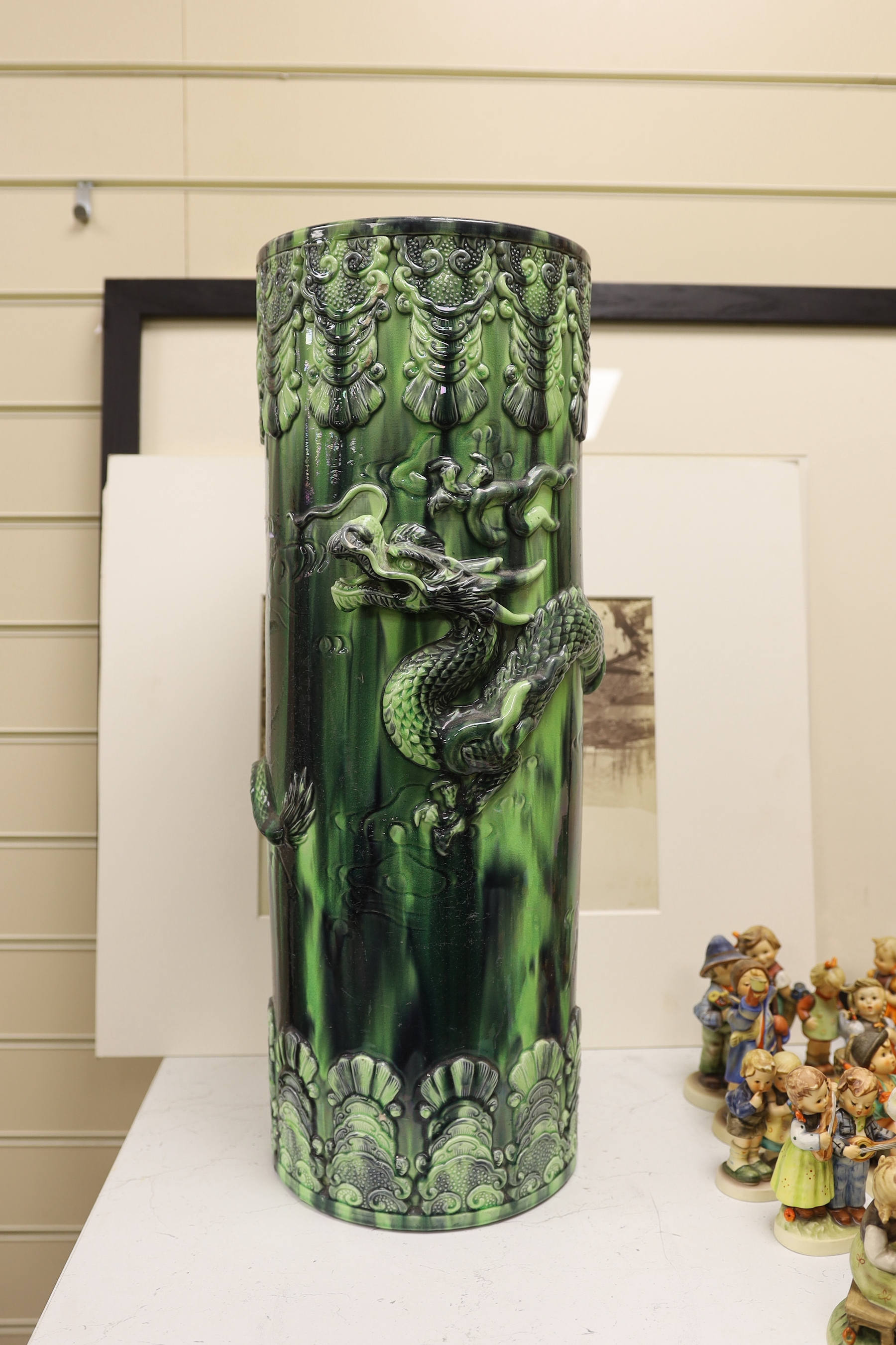 A Continental pottery dragon stick stand, 61cm